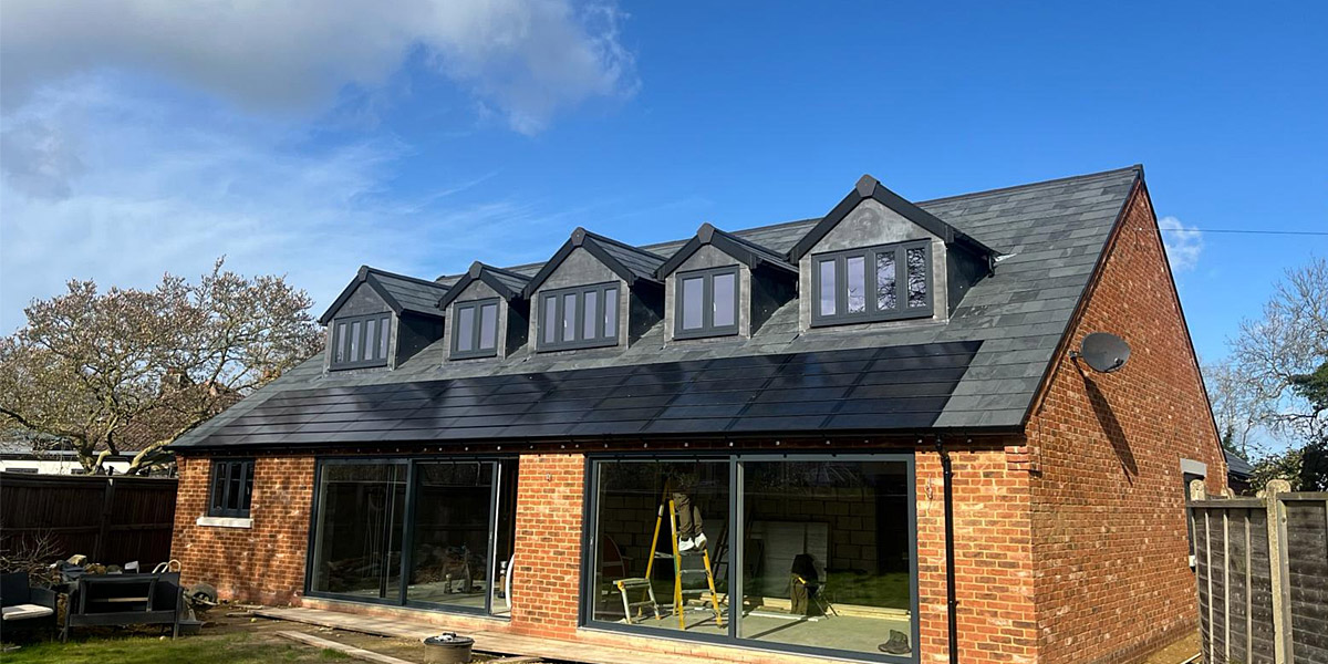 0008_Solar Tiles Under Dormers On New Roof Which Also Has Brazilian Slate In South England