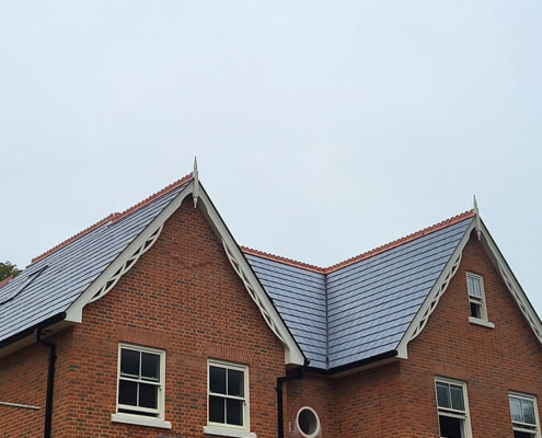 0022_Nulok Solar Tiles Installed With Spanish Slate On This Development In A Conservation Area Front Side View