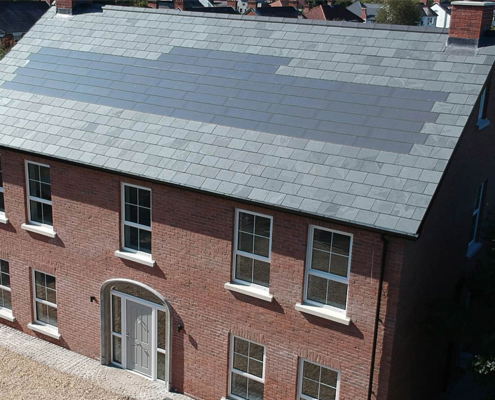 0041_New Build Development With Brazilian Slate and Solar Tiles On The Roof In Belfast