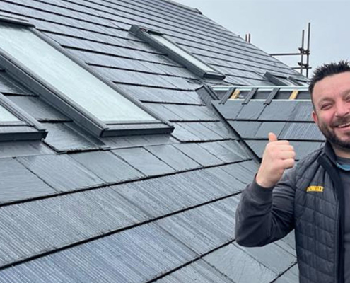 0048_Happy Nulok Installer On A New Solar Tile Installation In England