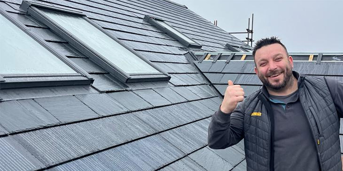 0048_Happy Nulok Installer On A New Solar Tile Installation In England
