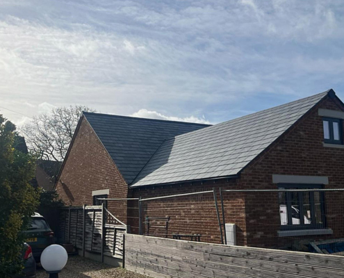 0067_Brazilian Slate Installed On The Nulok System On New Roof In England. This Is The Side View